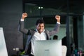 African businessman at office, success gesture, goal reached, happy man Royalty Free Stock Photo