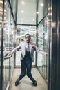 African Businessman screaming in elevator. fear claustrophobia concept Royalty Free Stock Photo