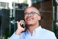 African businessman smiling with cell phone Royalty Free Stock Photo