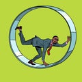 african businessman in a squirrel wheel. Routine monotonous work. A man in captivity of his affairs