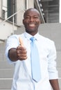 African businessman on stairs showing thumb up Royalty Free Stock Photo