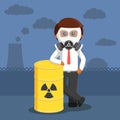 African businessman standing beside radiation barrel