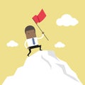 African businessman standing with red flag on mountain peak. Royalty Free Stock Photo