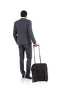 African businessman with suitcase in white room