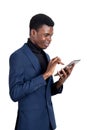 African businessman with tablet in hands, isolated over white ba Royalty Free Stock Photo