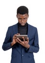 African businessman with tablet in hands, isolated over white ba Royalty Free Stock Photo