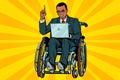 African businessman in wheelchair with laptop