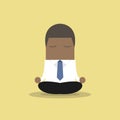 African businessman yoga relaxing during hard workday.