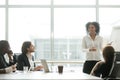 African businesswoman giving presentation working with flipchart Royalty Free Stock Photo