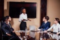 Businesswoman Leads Meeting Around Table Shot Royalty Free Stock Photo