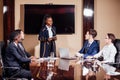 Businesswoman Leads Meeting Around Table Shot Royalty Free Stock Photo