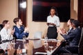 Businesswoman Leads Meeting Around Table Shot Royalty Free Stock Photo