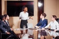 Businesswoman Leads Meeting Around Table Shot Royalty Free Stock Photo