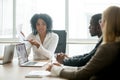 African businesswoman showing good statistics convincing multira Royalty Free Stock Photo