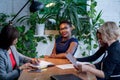 African female manager consulting women at her office promising benefits Royalty Free Stock Photo