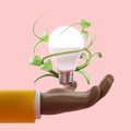 African cartoon hand with light bulb folded in grass Royalty Free Stock Photo