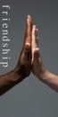 African and caucasian hands gesturing on gray studio background, tolerance and equality concept