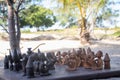 African chess, hand made from baobab wood. African style wooden figurine, local art Royalty Free Stock Photo