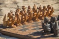 African chess, hand made from baobab wood. African style wooden figurine, local art Royalty Free Stock Photo