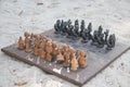 African chess, hand made from baobab wood. African style wooden figurine, local art Royalty Free Stock Photo