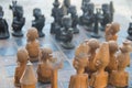 African chess, hand made from baobab wood. African style wooden figurine, local art Royalty Free Stock Photo