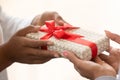 African child hands holding gift box give present to mom Royalty Free Stock Photo