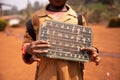 African child shows his blackboard with alphabet and the numbers engraved on it. Educational concept Royalty Free Stock Photo