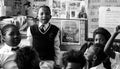 African children in a classroom, raising hands and talking in the Primary school in South Africa Royalty Free Stock Photo