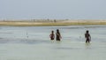 African children playing in the ocean