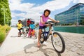 African children riding bikes one after another Royalty Free Stock Photo