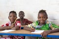 Four gorgeous African Black Children Sitting in Desks Royalty Free Stock Photo