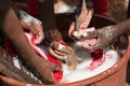 African Children Washing Laundry at Home as a Water Scarcity Con