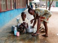 African children washing pots Royalty Free Stock Photo