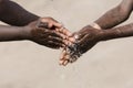 African Children Washing their Hands with Water Outdoors Royalty Free Stock Photo