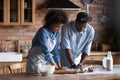 African couple cooking together in modern cozy kitchen Royalty Free Stock Photo