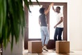 African millennial couple dancing at hallway on moving day Royalty Free Stock Photo