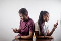 African Couple Holding Mobile Phones In a Hand Royalty Free Stock Photo