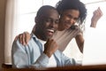 African couple look at computer feels excited celebrating lottery win Royalty Free Stock Photo