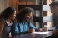 American couple buy property signing contract making deal with realtor Royalty Free Stock Photo