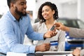 African Couple Taking Auto Key From Seller In Dealership Office Royalty Free Stock Photo