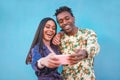 African couple taking selfie photo for social network story - Influencers people having fun with new trend technology - Love, Royalty Free Stock Photo