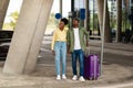 African Couple With Travel Suitcase Standing Looking Aside Near Airport Royalty Free Stock Photo