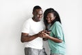 African couple using mobile phone