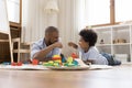 African dad and little son fist bumping making bet Royalty Free Stock Photo