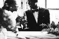African Descent Bride and Groom Clinking Glasses Together Royalty Free Stock Photo