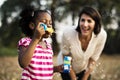 African descent girl is playing bubbles Royalty Free Stock Photo