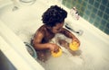 African descent kid enjoy bathing