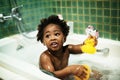 African descent kid enjoying bath tub