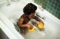 African descent kid enjoying bath tub Royalty Free Stock Photo