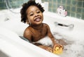 African descent kid enjoying bath tub Royalty Free Stock Photo